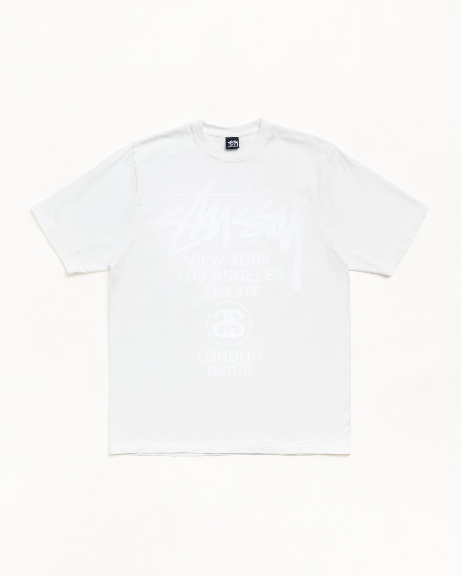 Stussy World Tour Tee — Pigment Dyed Natural