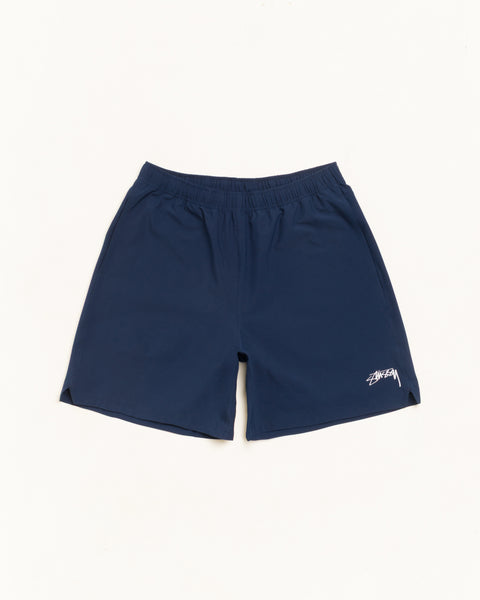 Sport Short short in Navy, unisex performance fabric with elastic waist and Stüssy logo