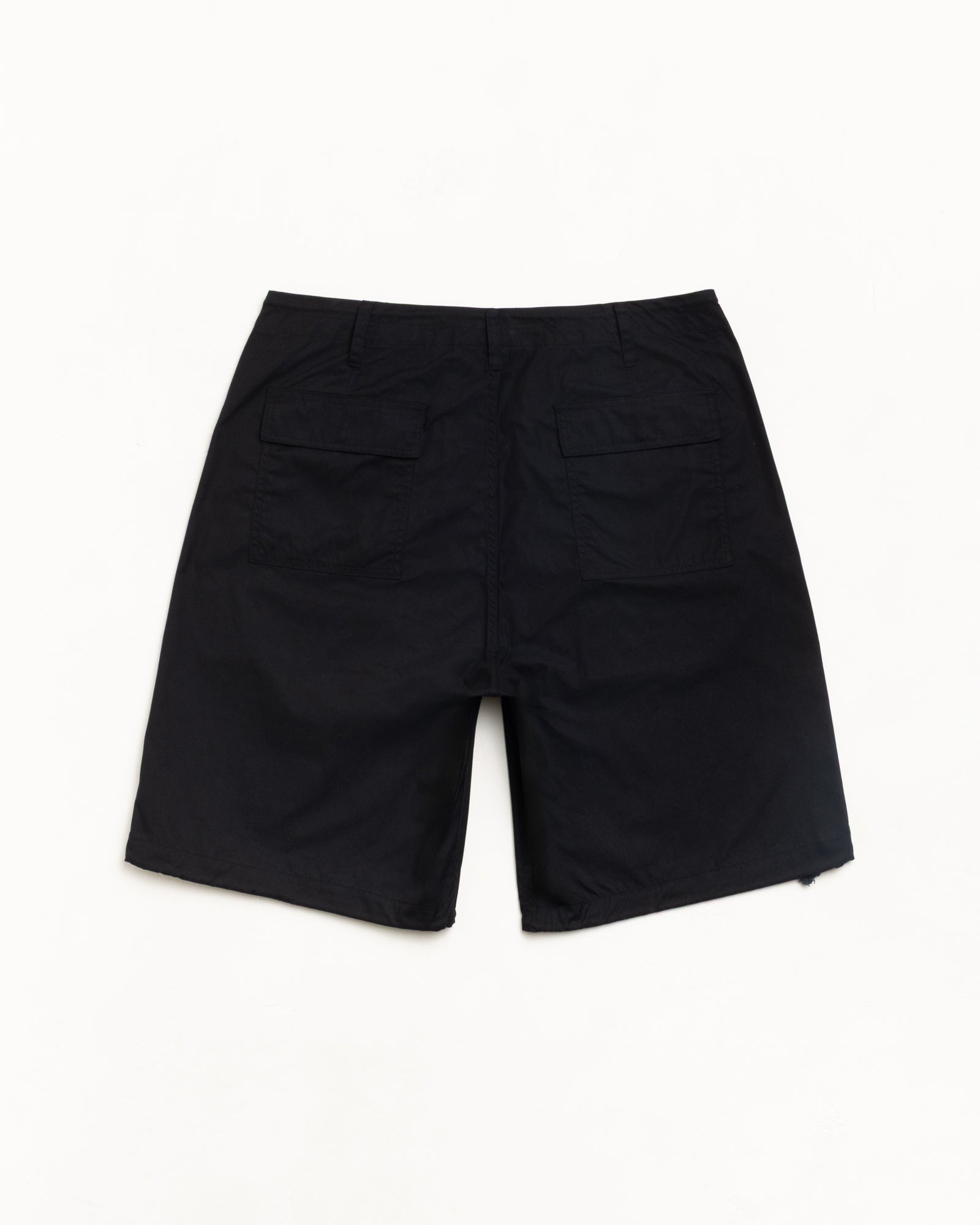 Surplus Short in Black, back view with dual flap pockets; flat lay on white