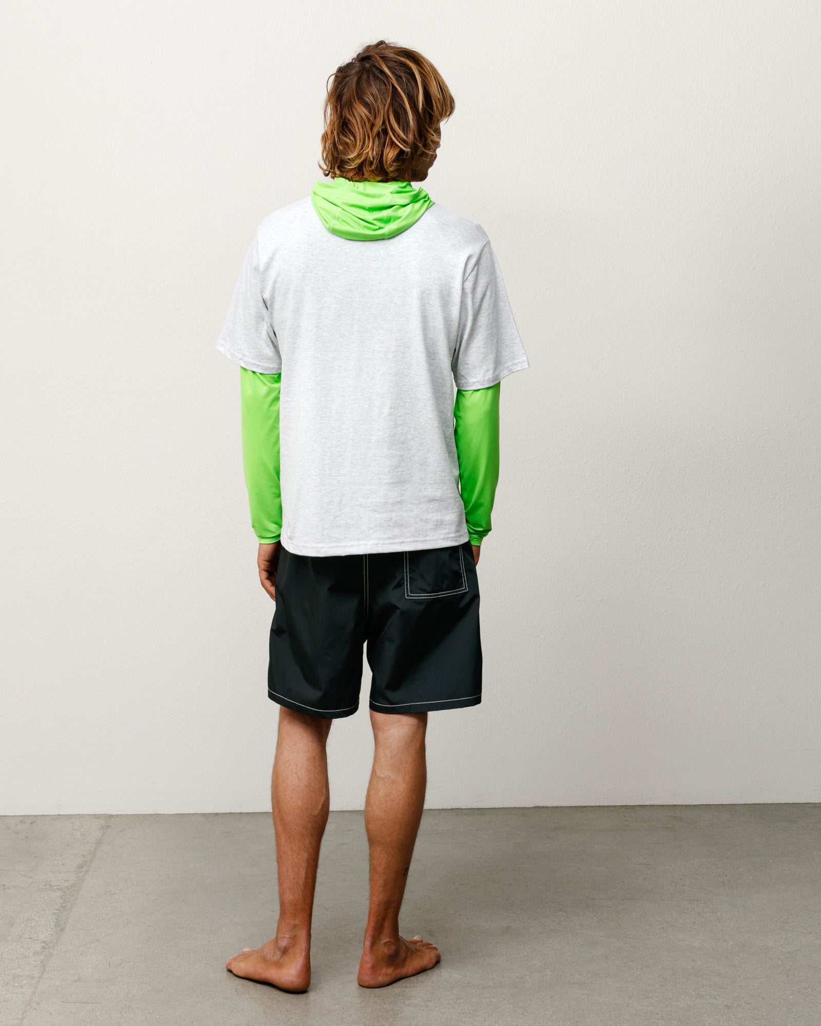 Coastal Board Short Unisex Regular In Black, back view on model