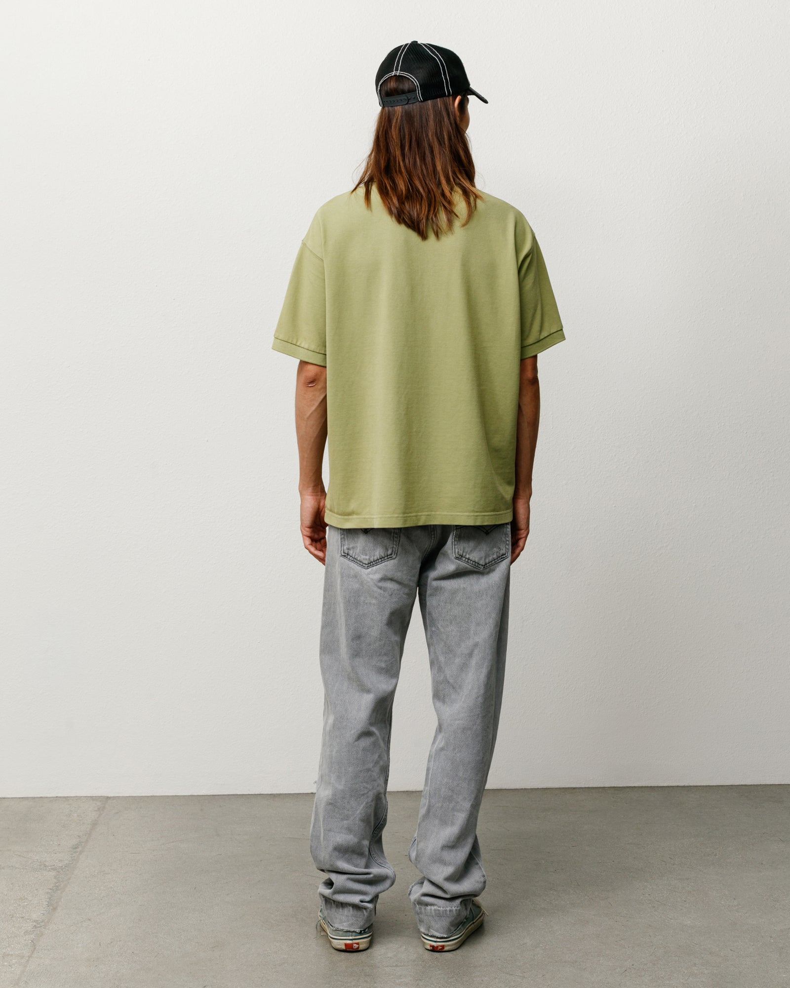 Classic Pique Polo Short Sleeve in Leaf, on-model back view with relaxed fit