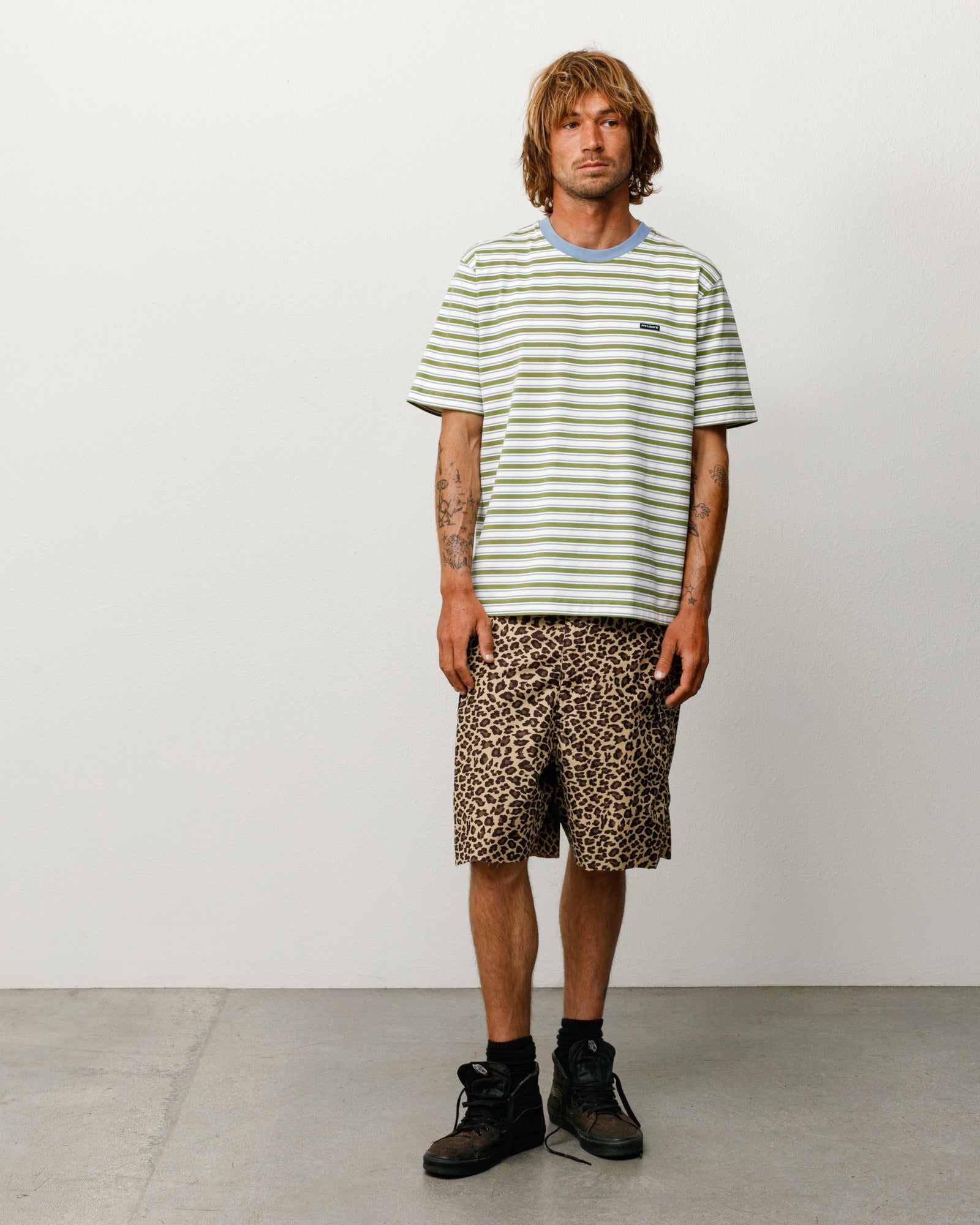 Beach Stripe Tee in Moss with blue ribbed collar, modeled front view