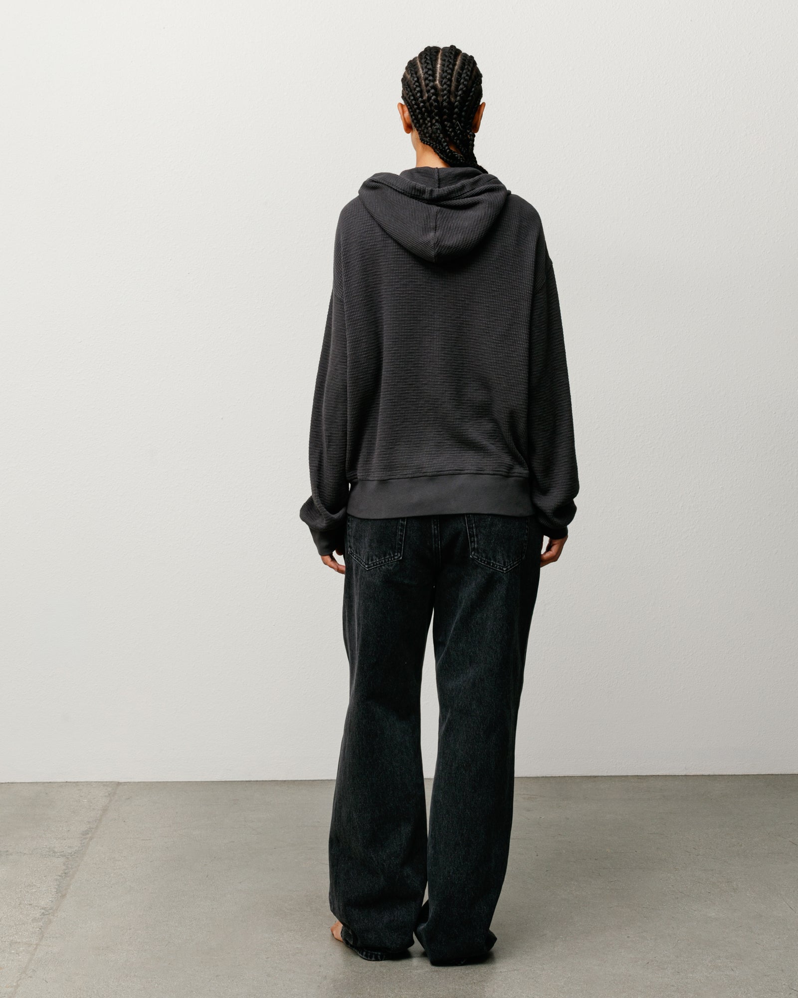 Lightweight Thermal Hoodie in Faded Black, unisex long sleeve, back view on model