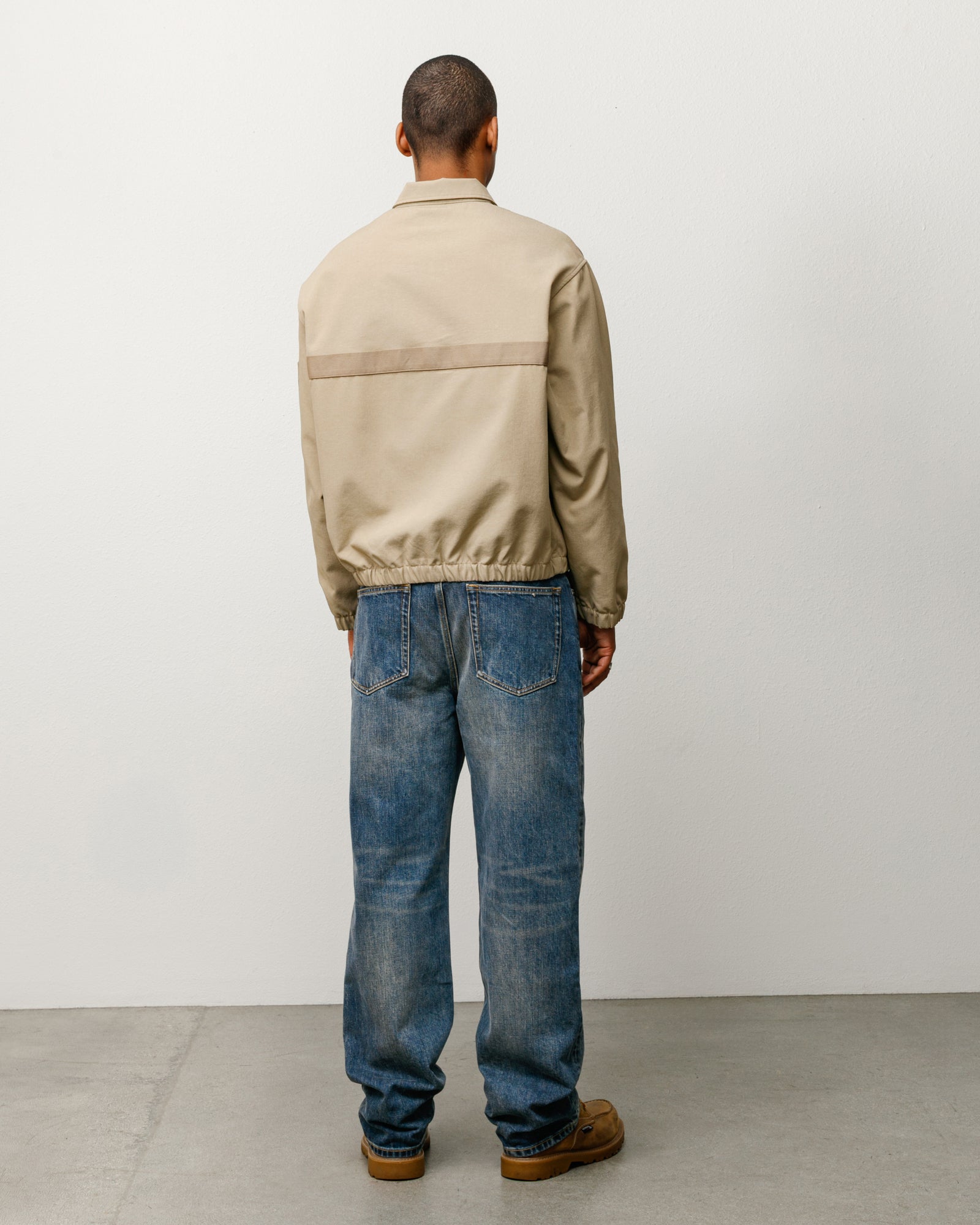 Mechanic Jacket in Khaki, back view with horizontal webbing stripe and elastic hem