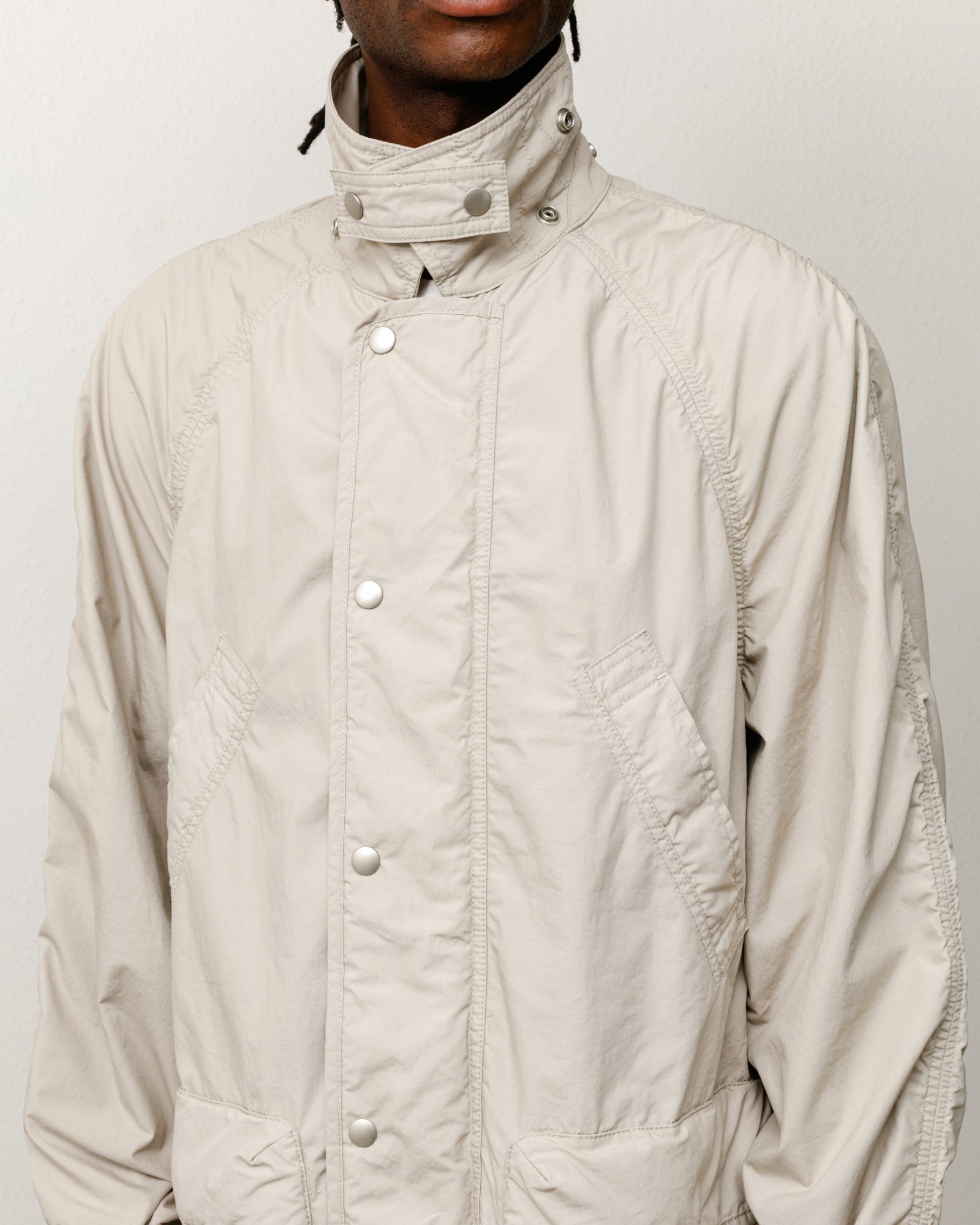 Lightweight Field Parka jacket in Stone washed cotton with snap-front placket.