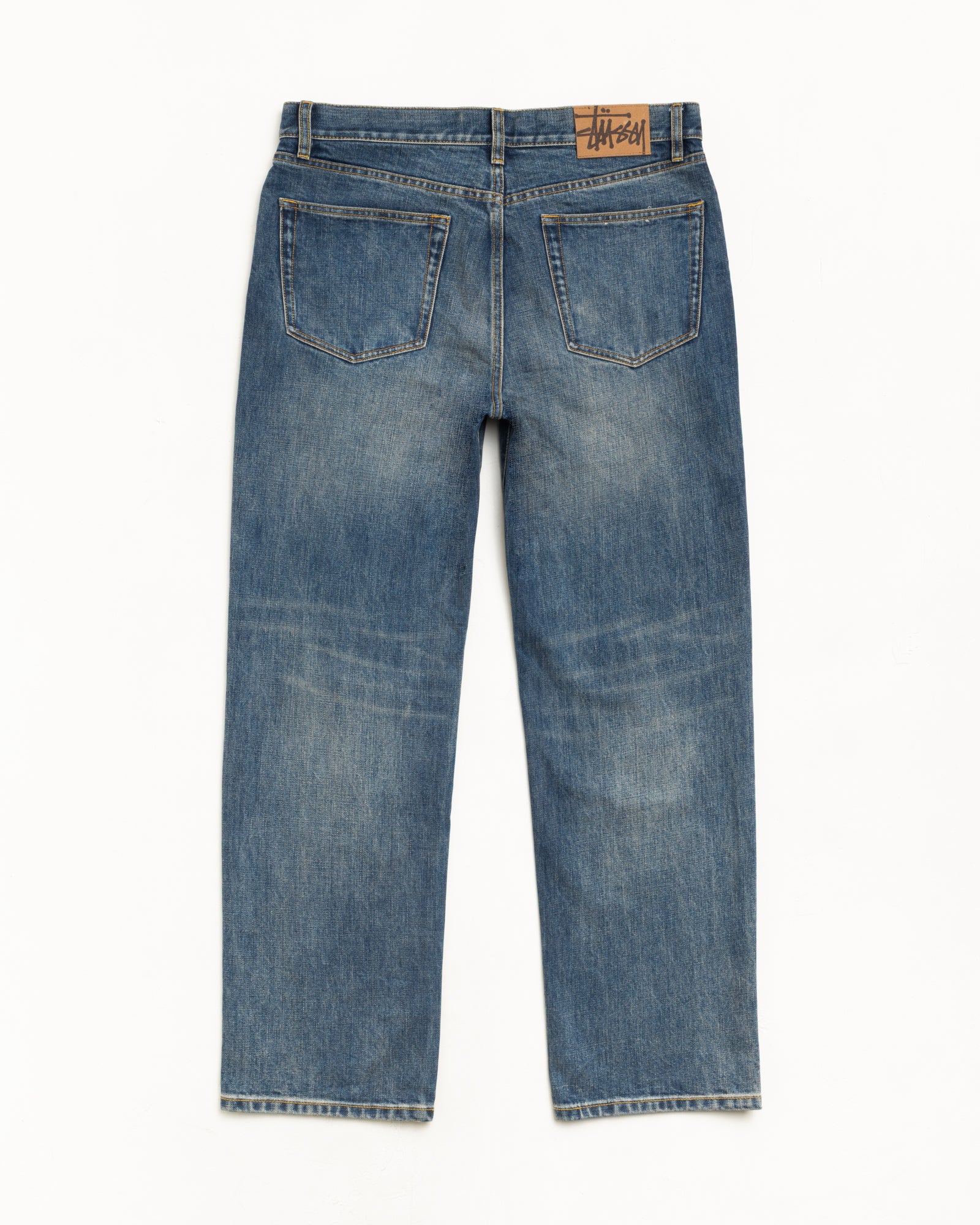 New Classic Jean Slub Denim in Blue, back view with suede Stüssy logo patch and straight leg