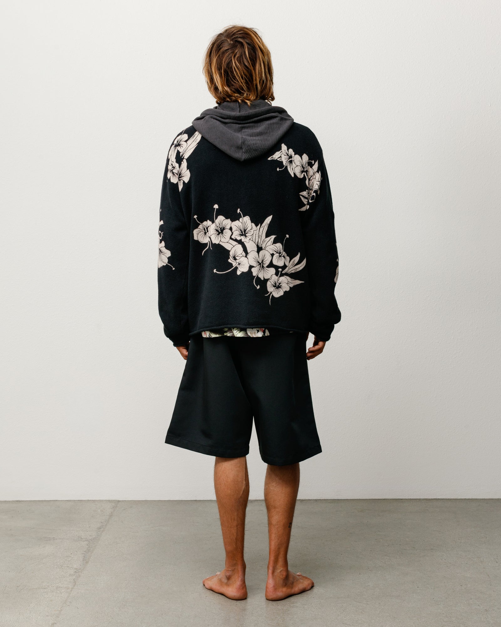 Floral Roll Neck Sweater in Black, back view with allover floral knit and relaxed fit.