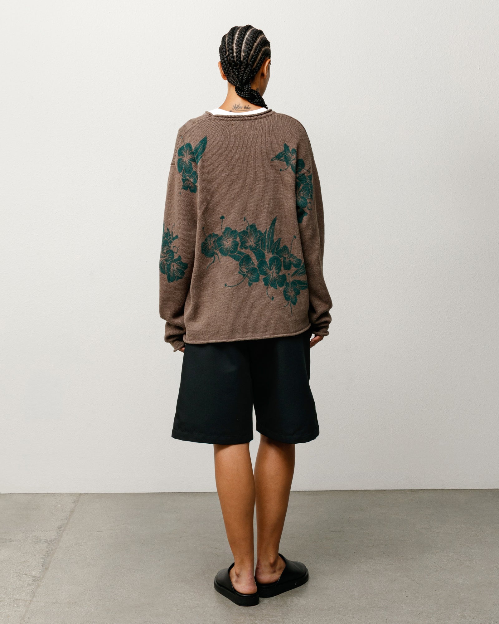 Floral Roll Neck Sweater in Brown with green floral motif, back view on model