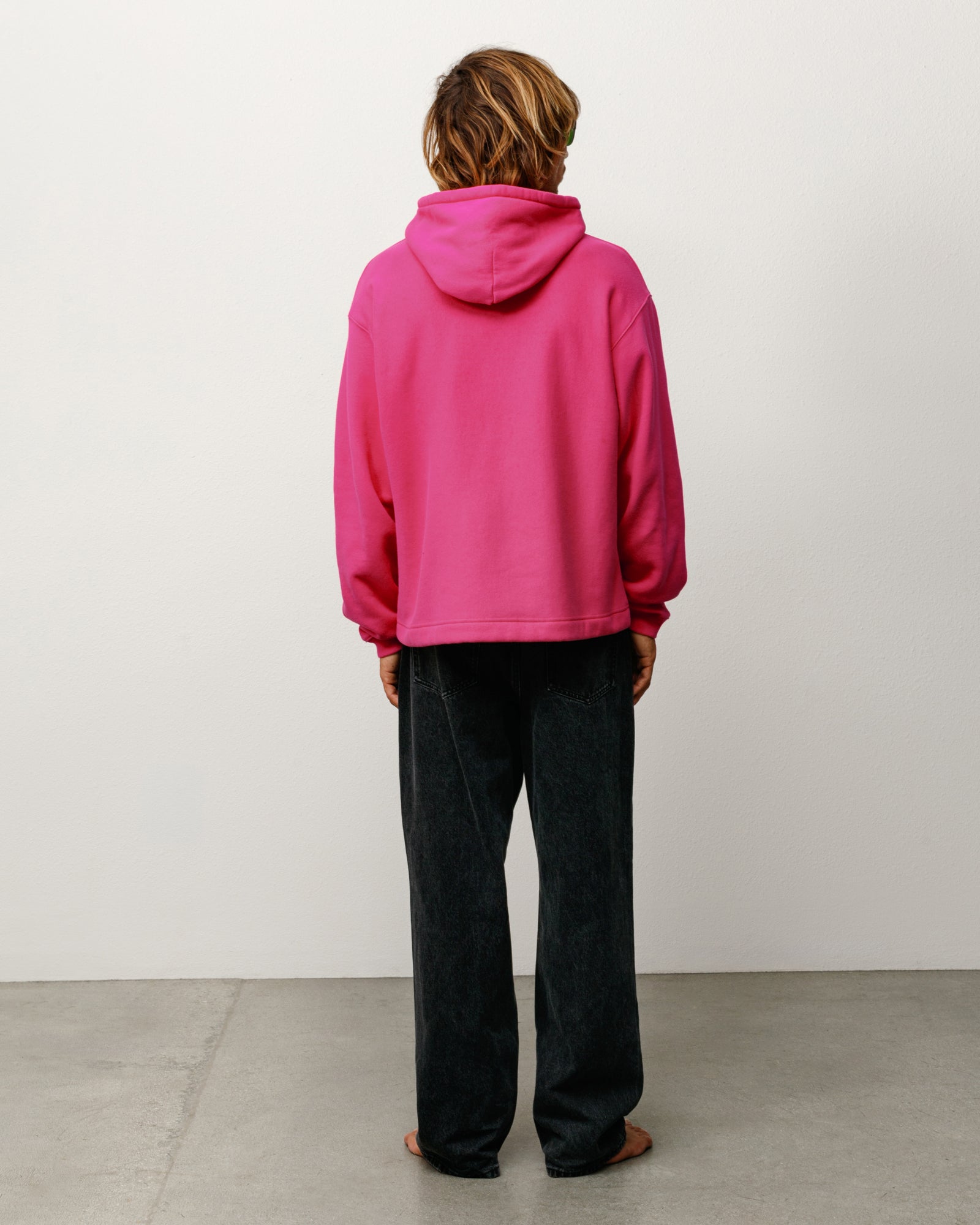 Oval Pullover Hoodie in Pink, relaxed fit long-sleeve, model back view.