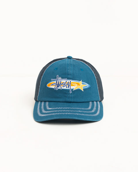 Oval Star Cap in blue cotton twill with Stüssy logo and star embroidery, contrast zigzag stitching
