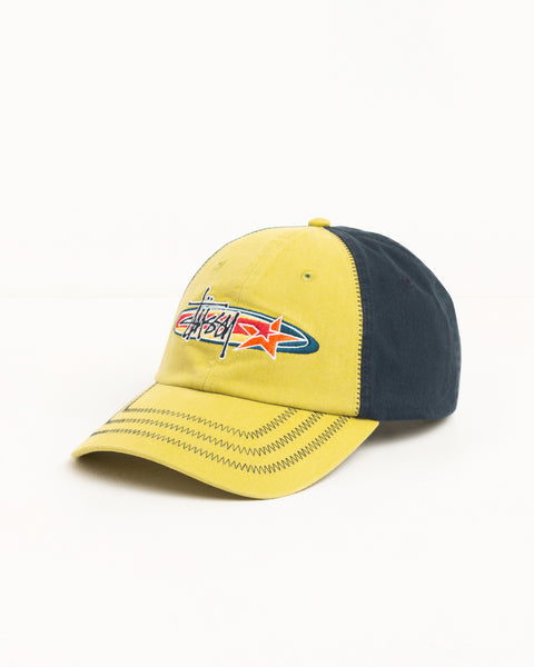Oval Star Cap in Lime with contrast navy panels, zig-zag brim stitching, and Stüssy logo embroidery