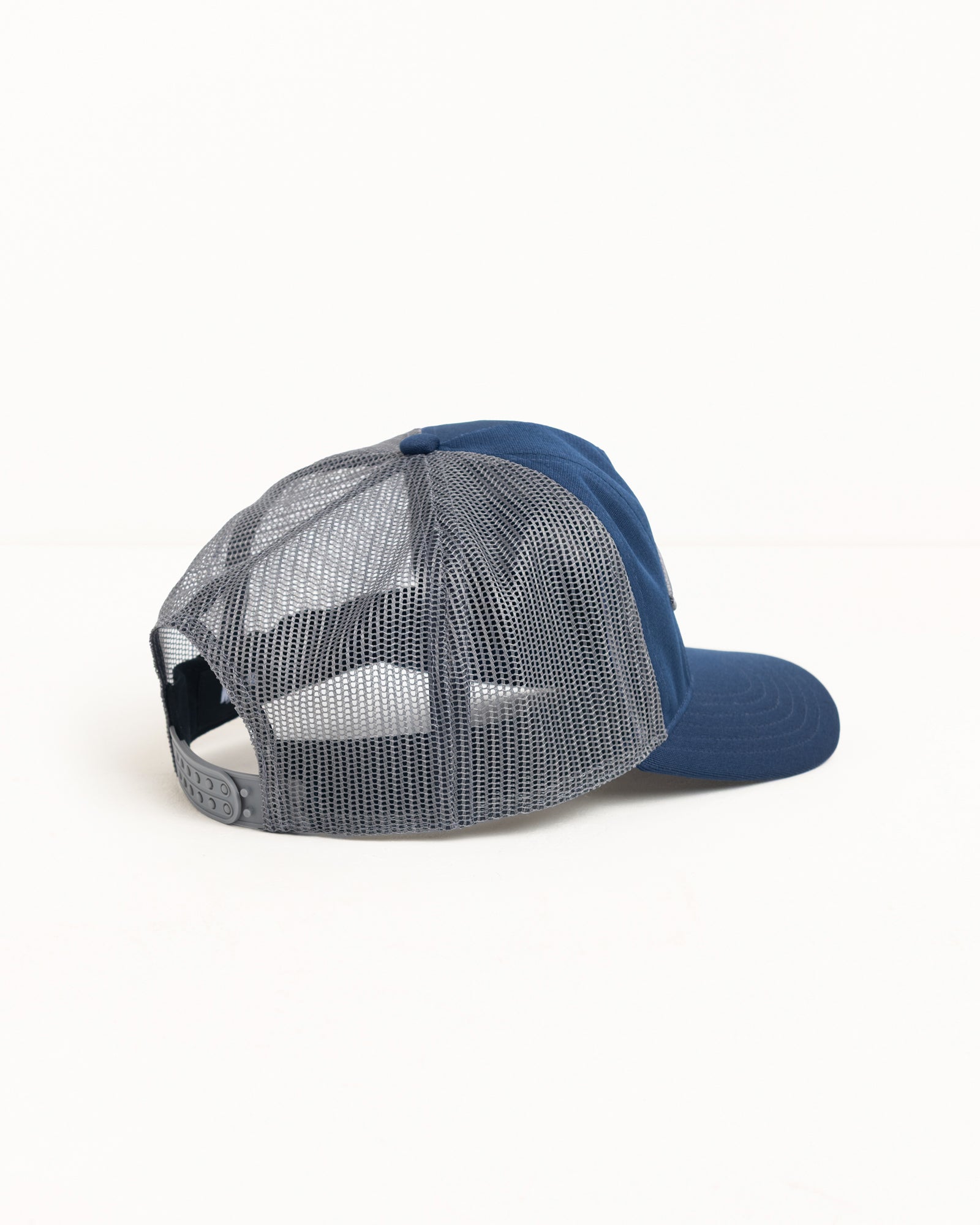 Tough Gear Trucker cap in Navy with gray mesh back and adjustable snapback closure