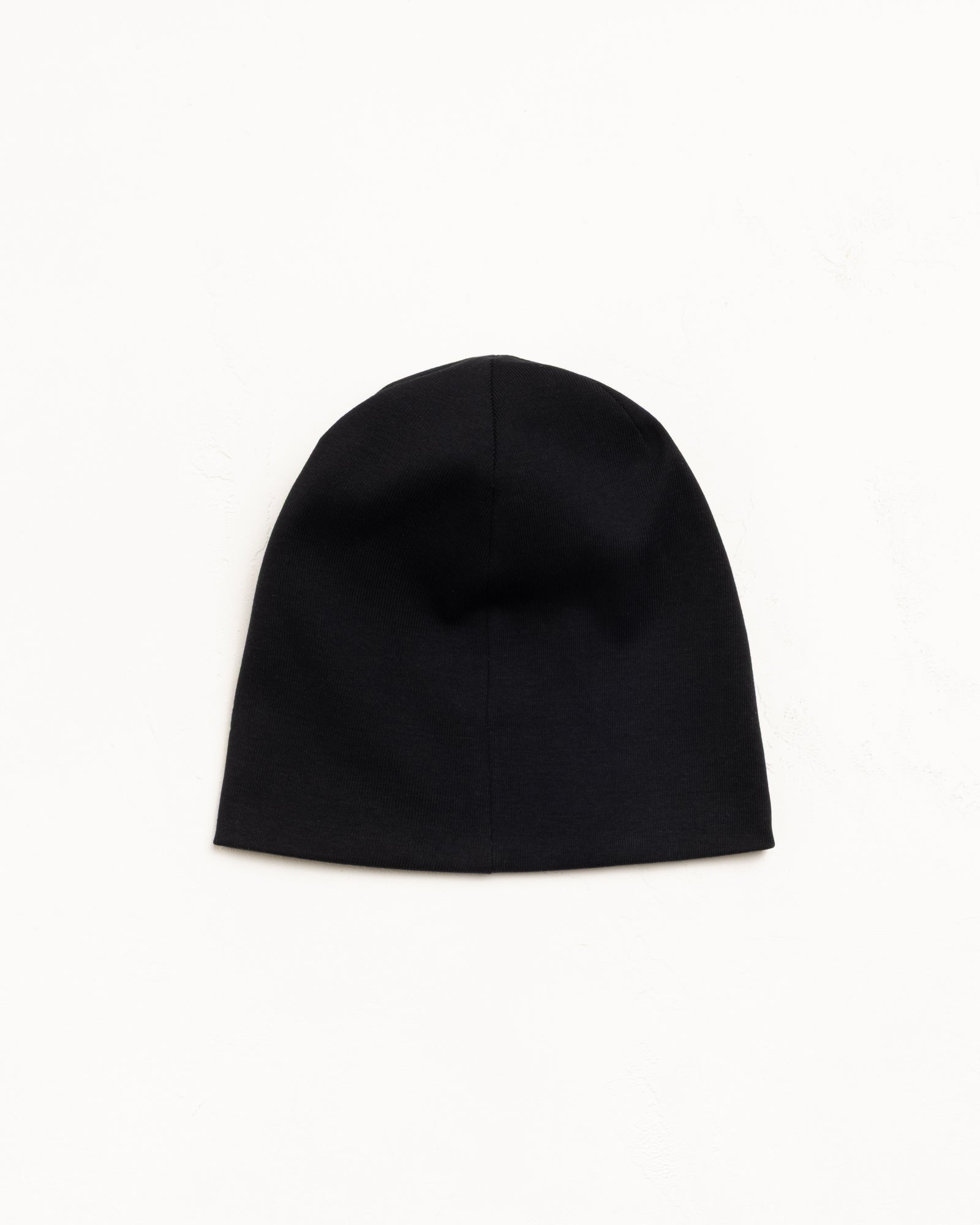 Jersey Skullcap Beanie in Black, flat lay on white