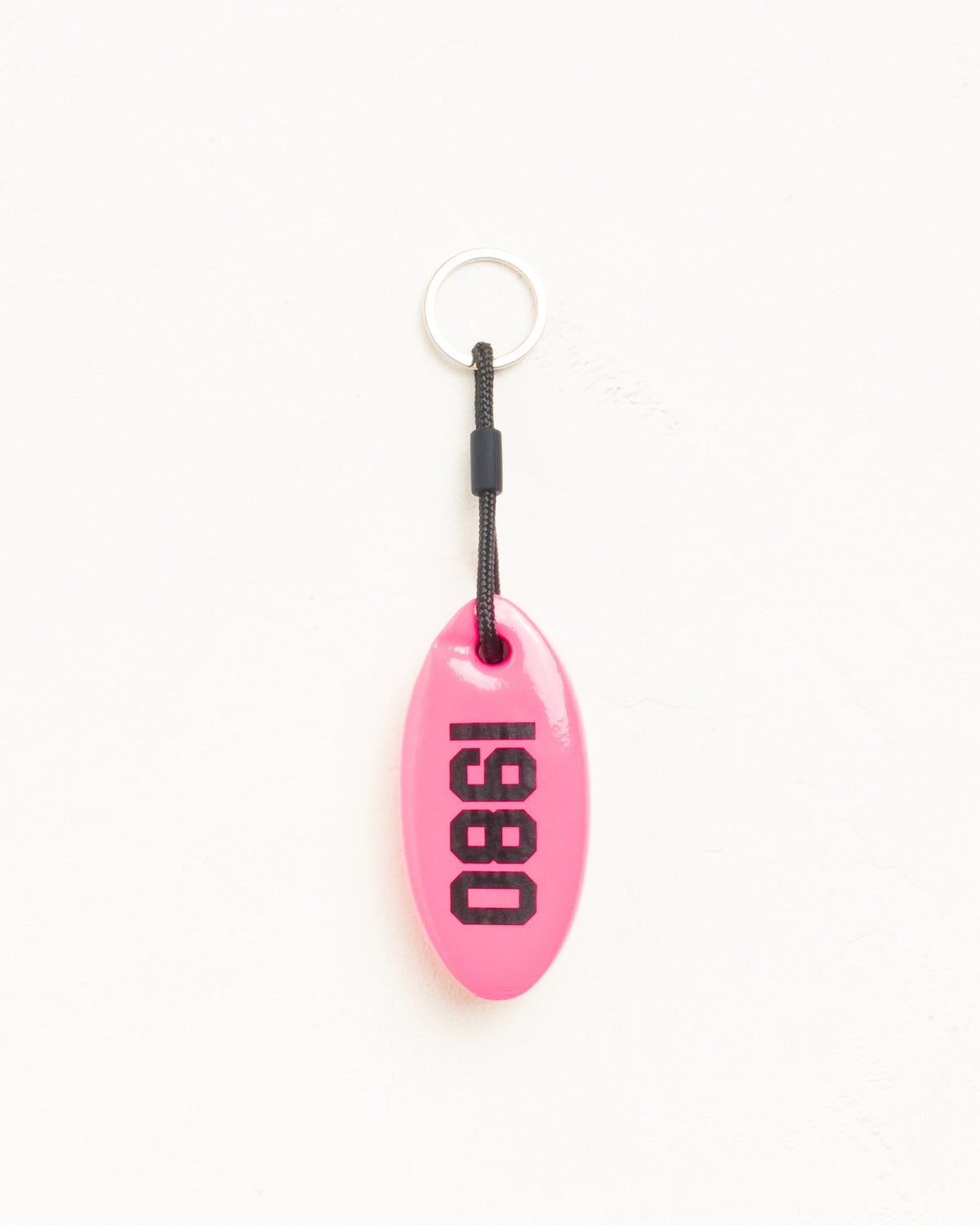 Floatie Keychain in pink vinyl-coated foam with Stüssy logo and 1980 print