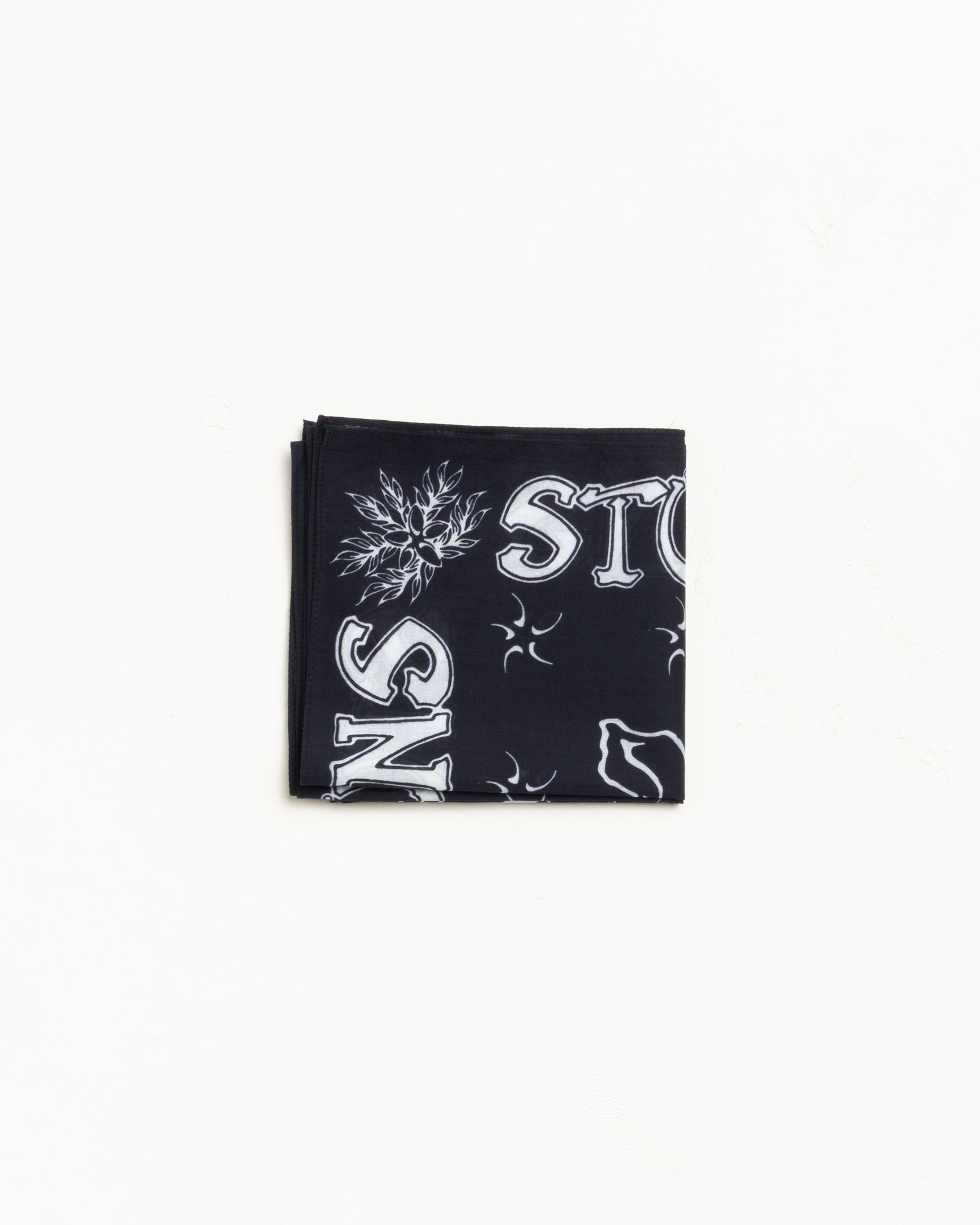 Surf Joker Bandana in Black cotton with white graphics, folded flat