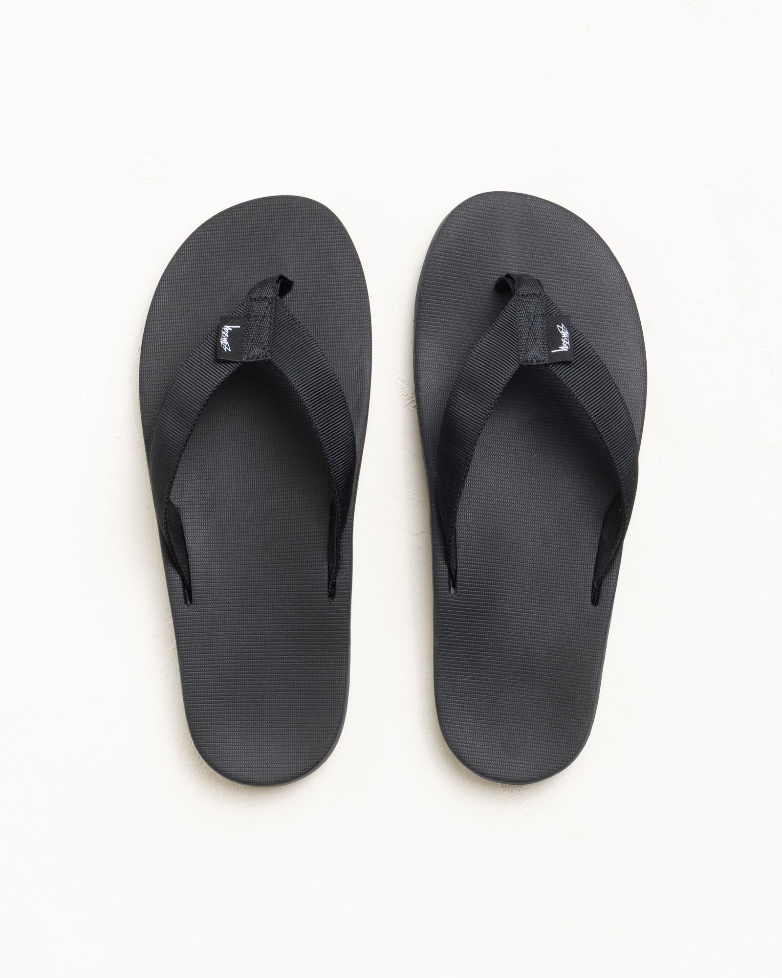 Rubber Flip-Flop Footwear in Black with wide straps and textured footbed